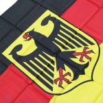Drapeau noir, rouge et or avec aigle central